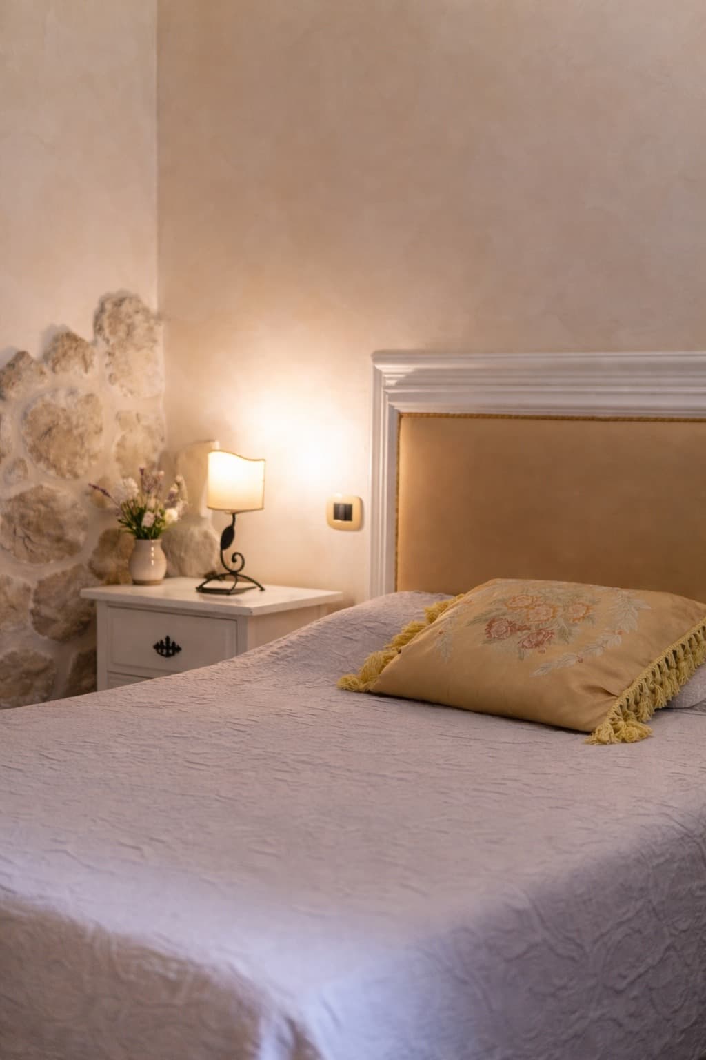 Restored villa interiors featuring authentic Tuscan architecture, exposed beams, and curated antique furnishings